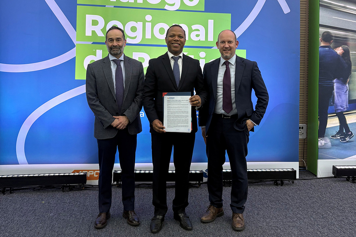 INTRANT’s Executive Director, Milton Morrison, with the signed regulations alongside the FIA Foundation.